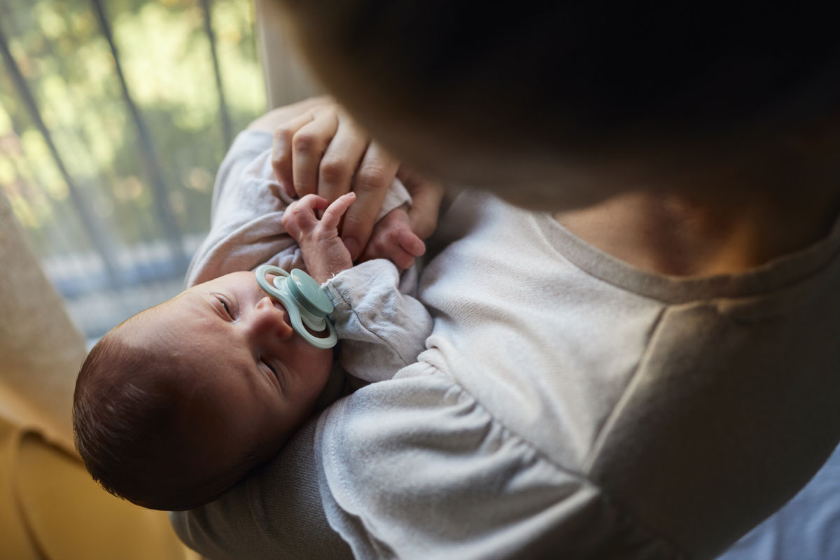 Infant Using Pacifier Infant Pacifiers: Benefits, Safety Tips, and When to Wean