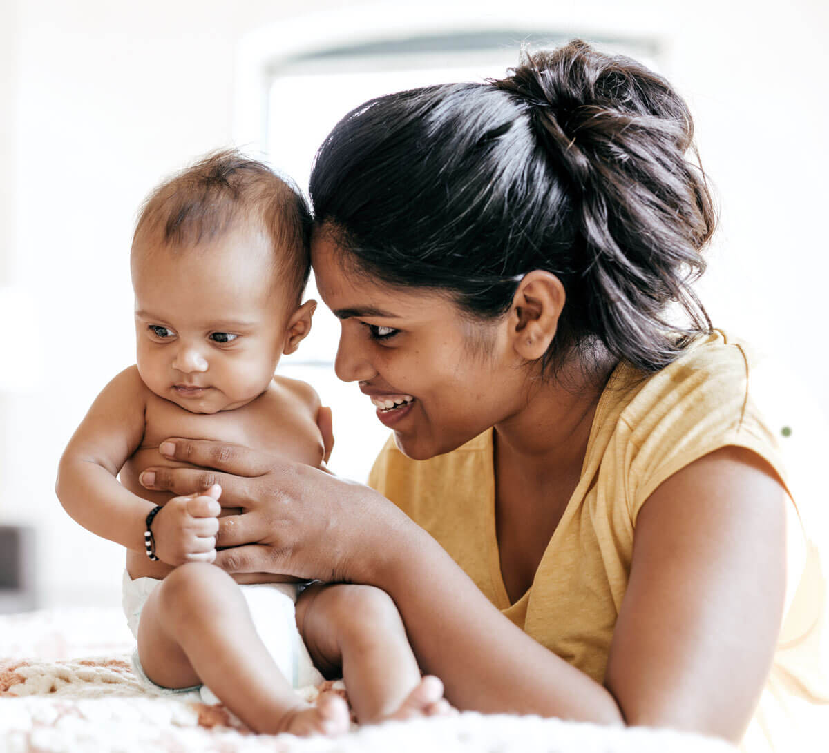 mom holding baby