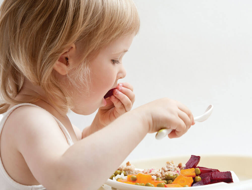 baby girl eating food