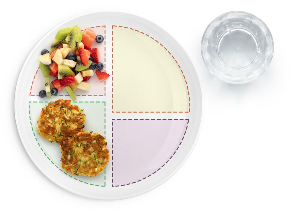 Section showing image of Zucchini Fritters and diced fruit
