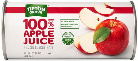 Apple juice concentrate can with fresh apple slices.