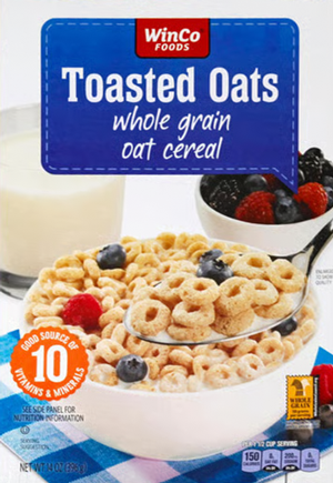 Bowl of toasted oats with berries and milk.