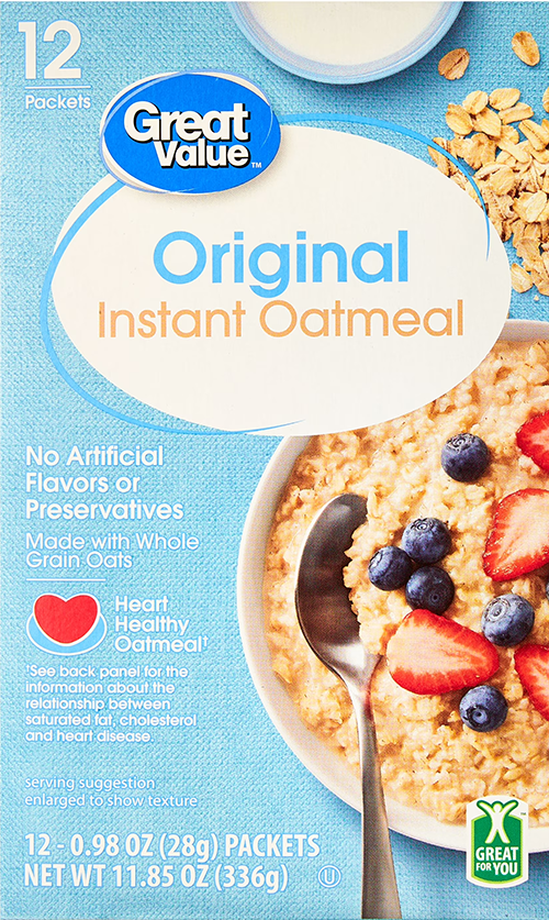 Oatmeal box with spoon and fresh fruit topping.