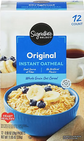 Oatmeal box showing bowl with banana slices and blueberries.