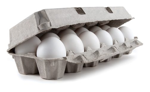 Carton of white eggs partially opened.