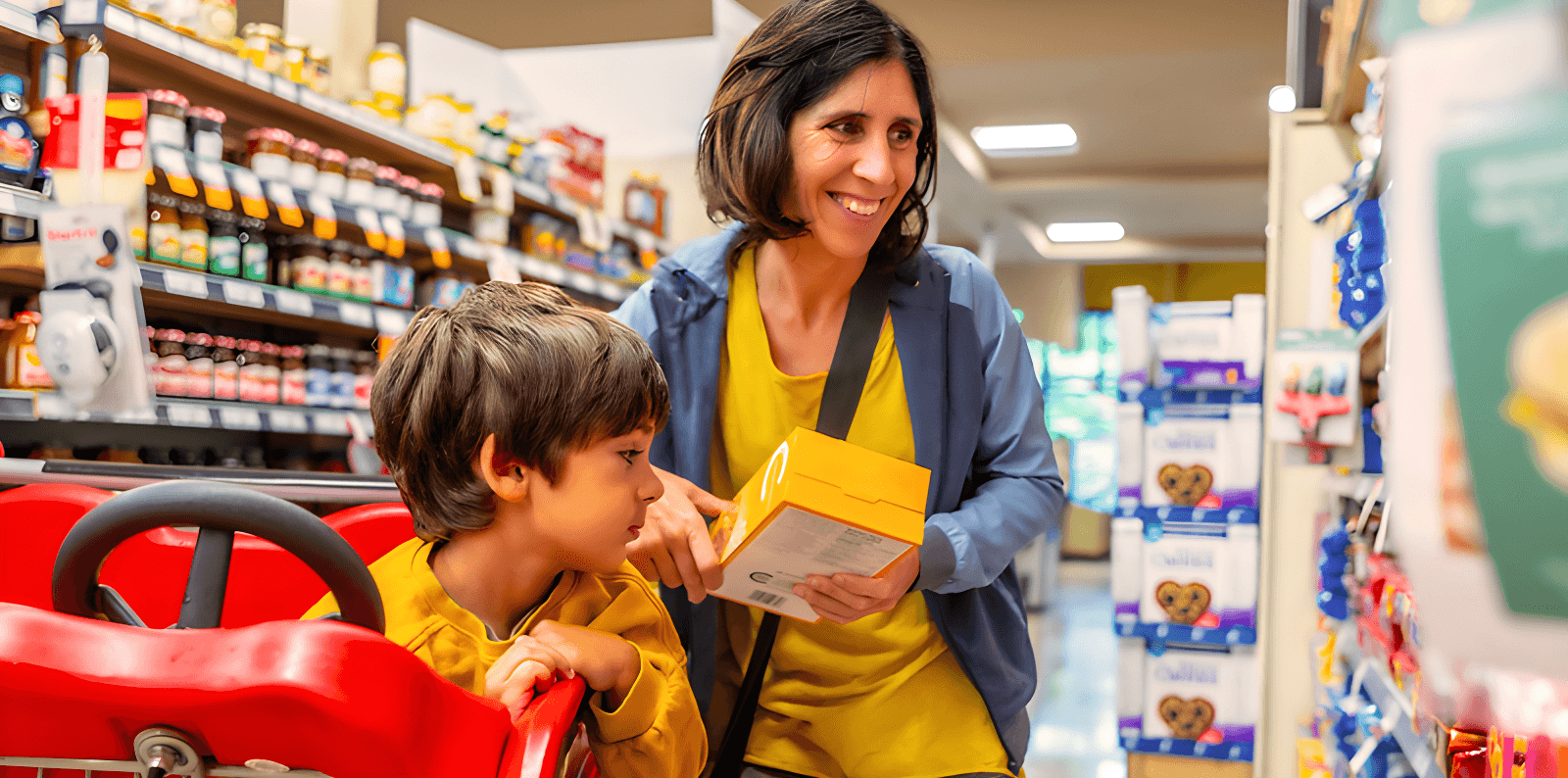 Mom and child shopping in grocery aisle