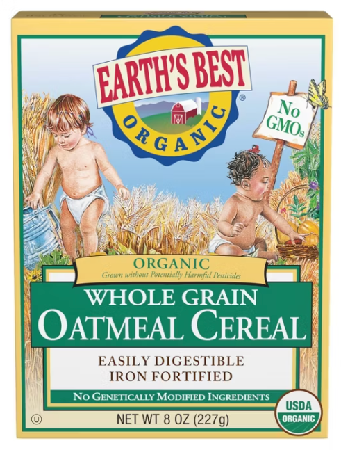 Two toddlers playing in a wheat field.