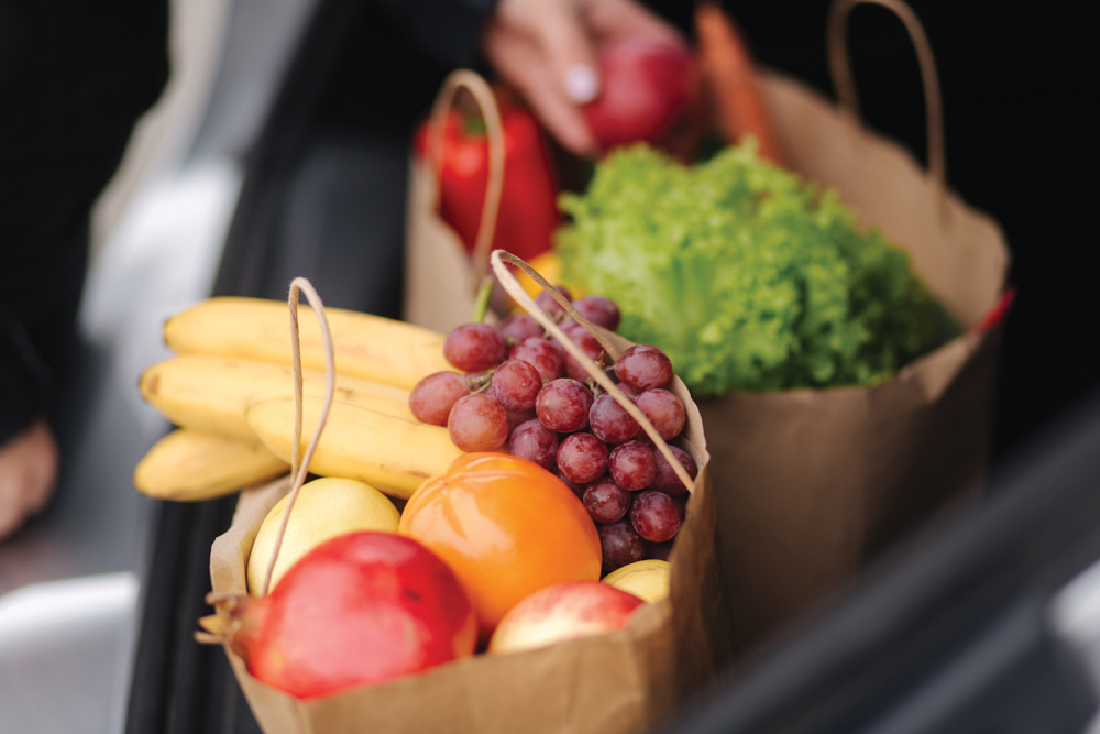 Bags filled with fresh fruits and vegetables
